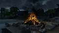 Jaanaford residents chat quietly by the fire at midnight