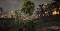 Palms line the main causeway leading to the docks, now engulfed in flames.